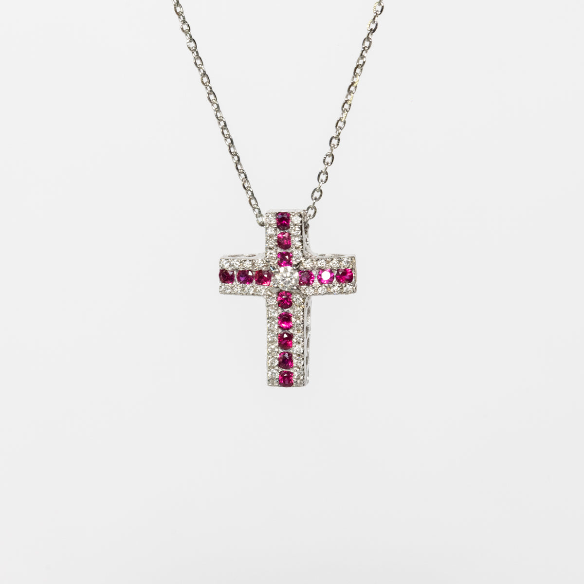 Collana croce in oro bianco 18 kt con rubini e diamanti