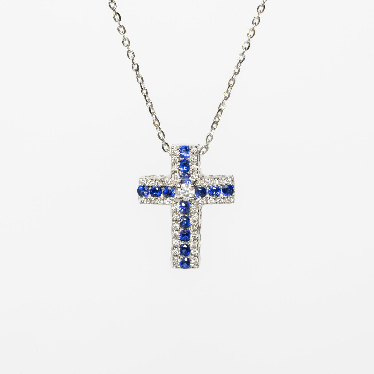 Collana croce in oro bianco 18kt con zaffiri e diamanti