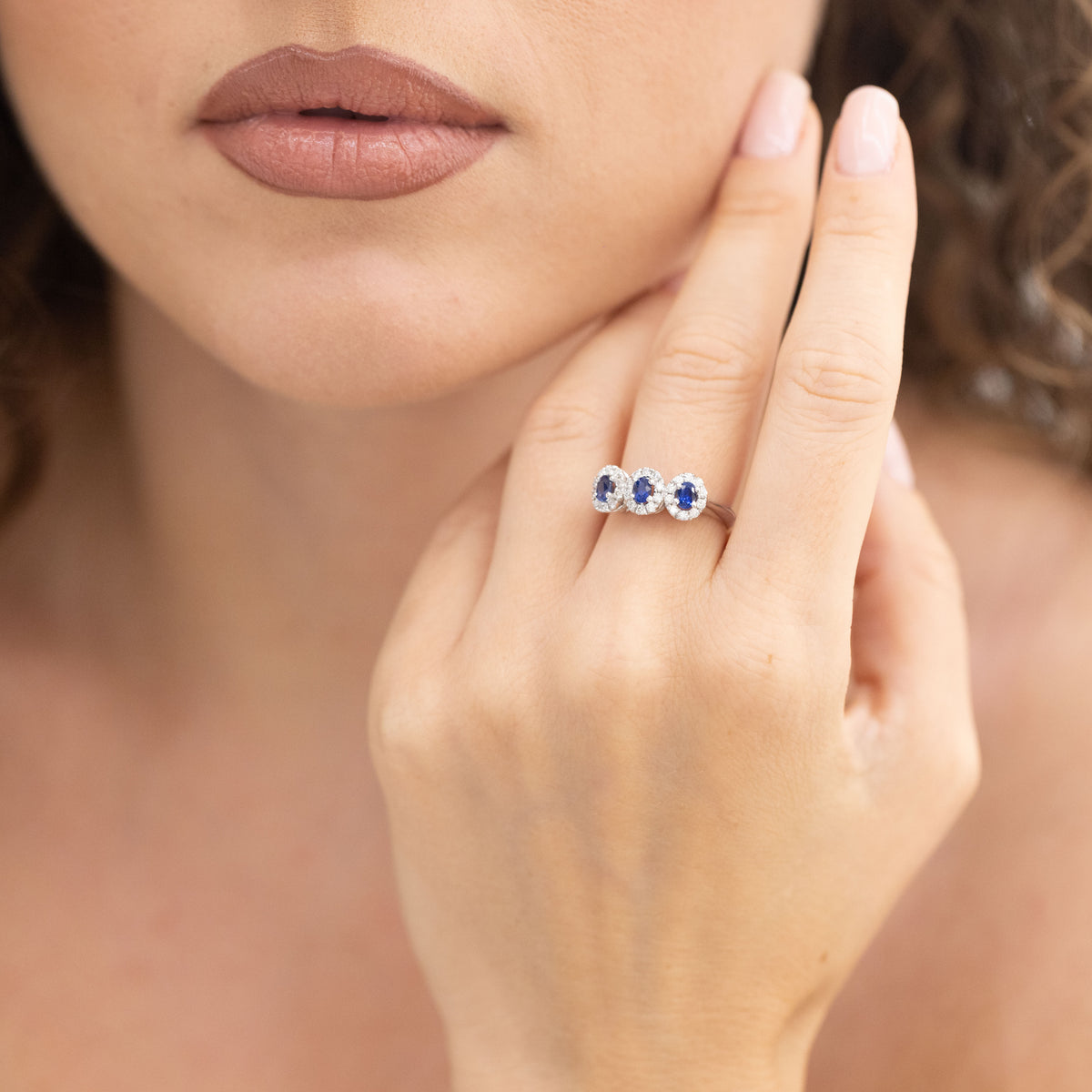 White Gold Trilogy Ring With Sapphires Surrounded By Diamonds
