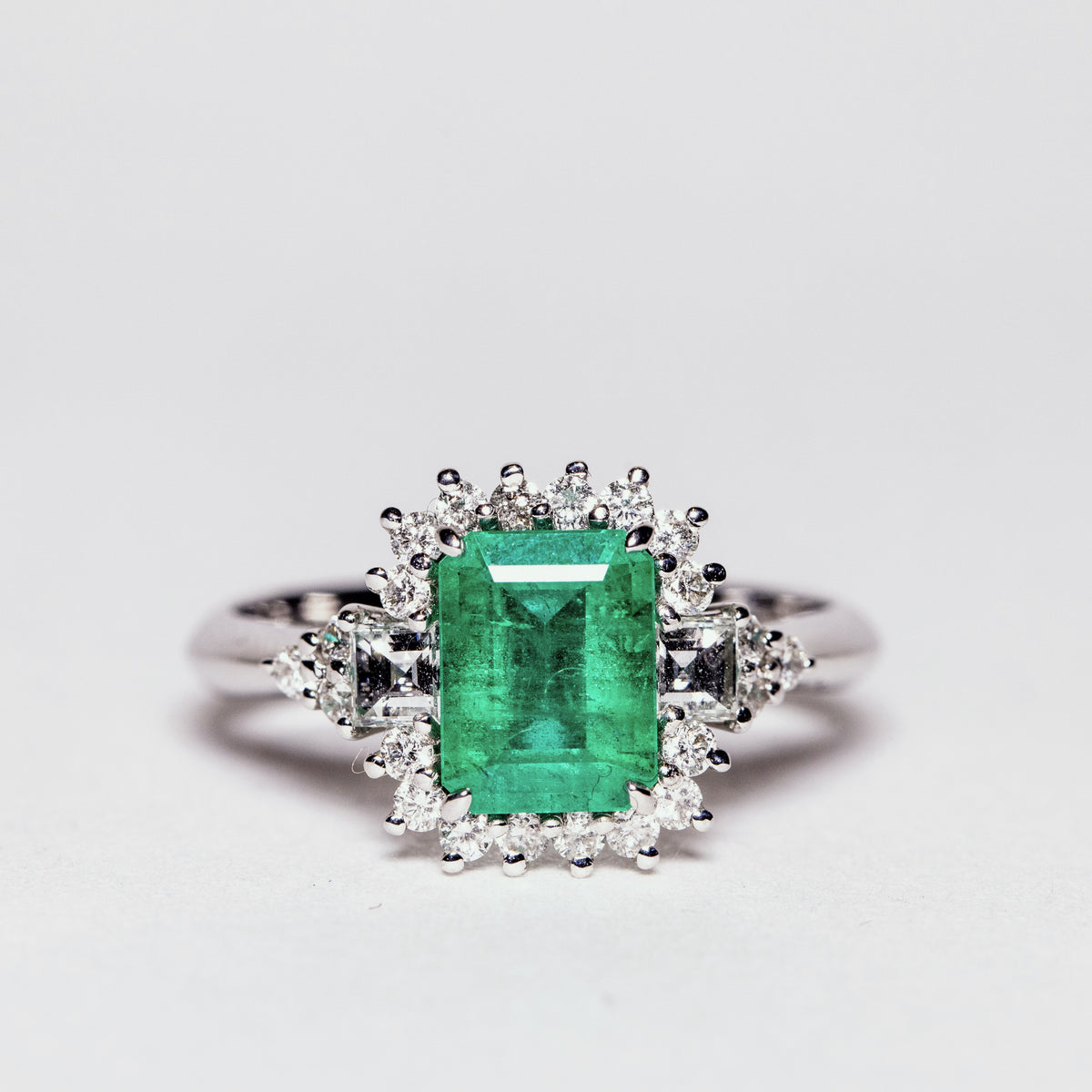 18kt White Gold Ring with 1.66ct Emerald Surrounded by Square Cut Diamonds