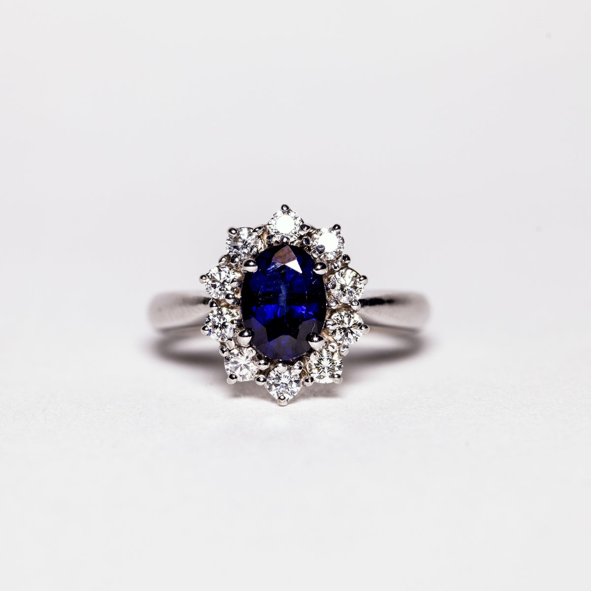 18KT White Gold Ring with 1.68 Carat Oval Sapphire and Diamond Surround