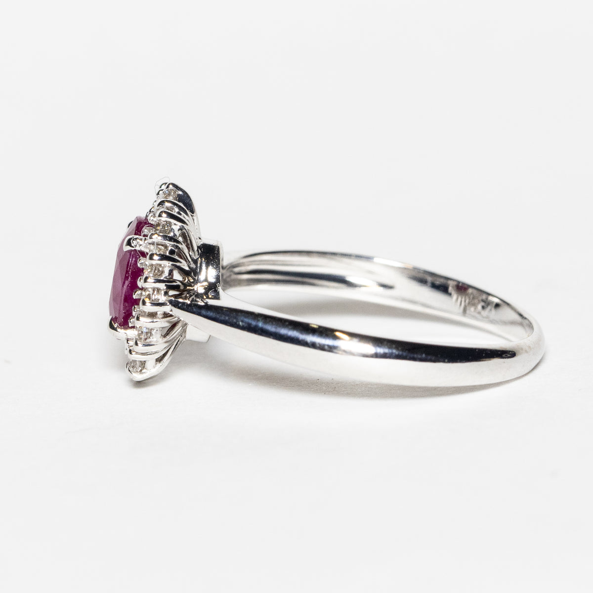 18KT White Gold Ring with Oval Central Ruby and Diamond Surround