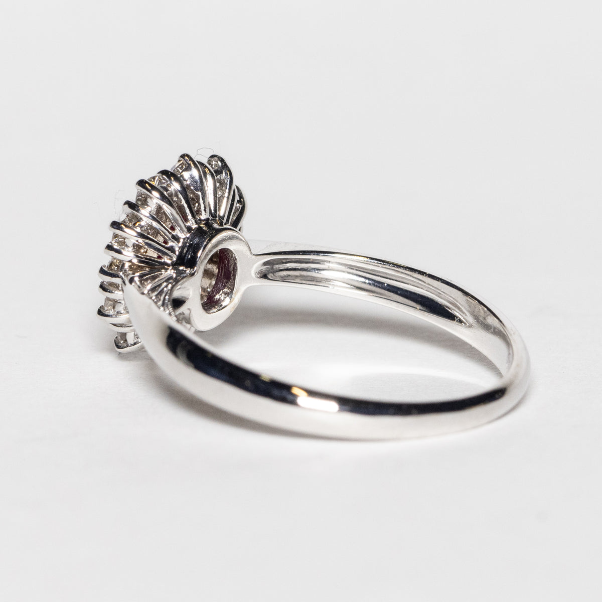 18KT White Gold Ring with Oval Central Ruby and Diamond Surround