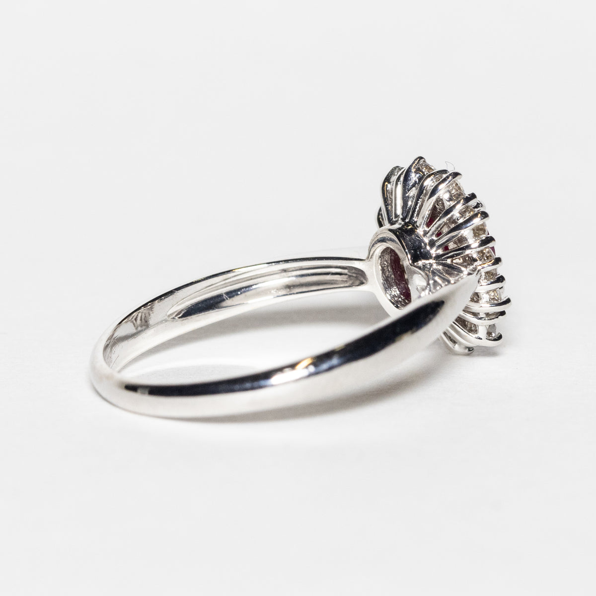 18KT White Gold Ring with Oval Central Ruby and Diamond Surround