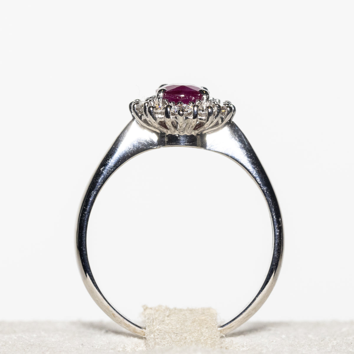 18KT White Gold Ring with Oval Central Ruby and Diamond Surround