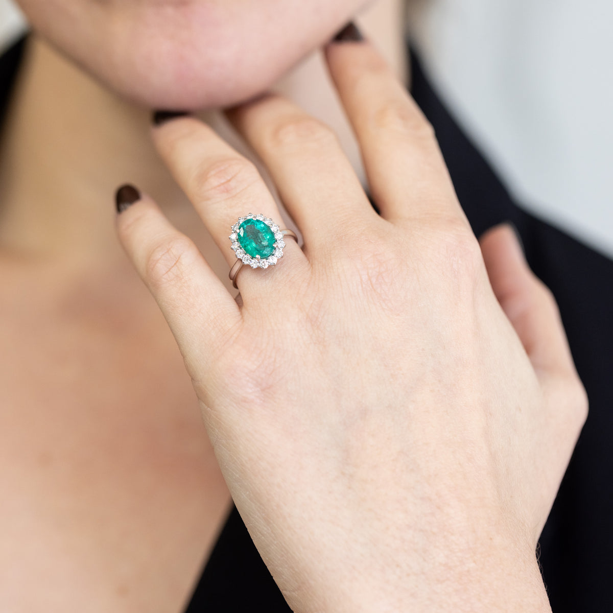 18KT White Gold Ring with 2.11 ct Oval Emerald and Diamond Surround