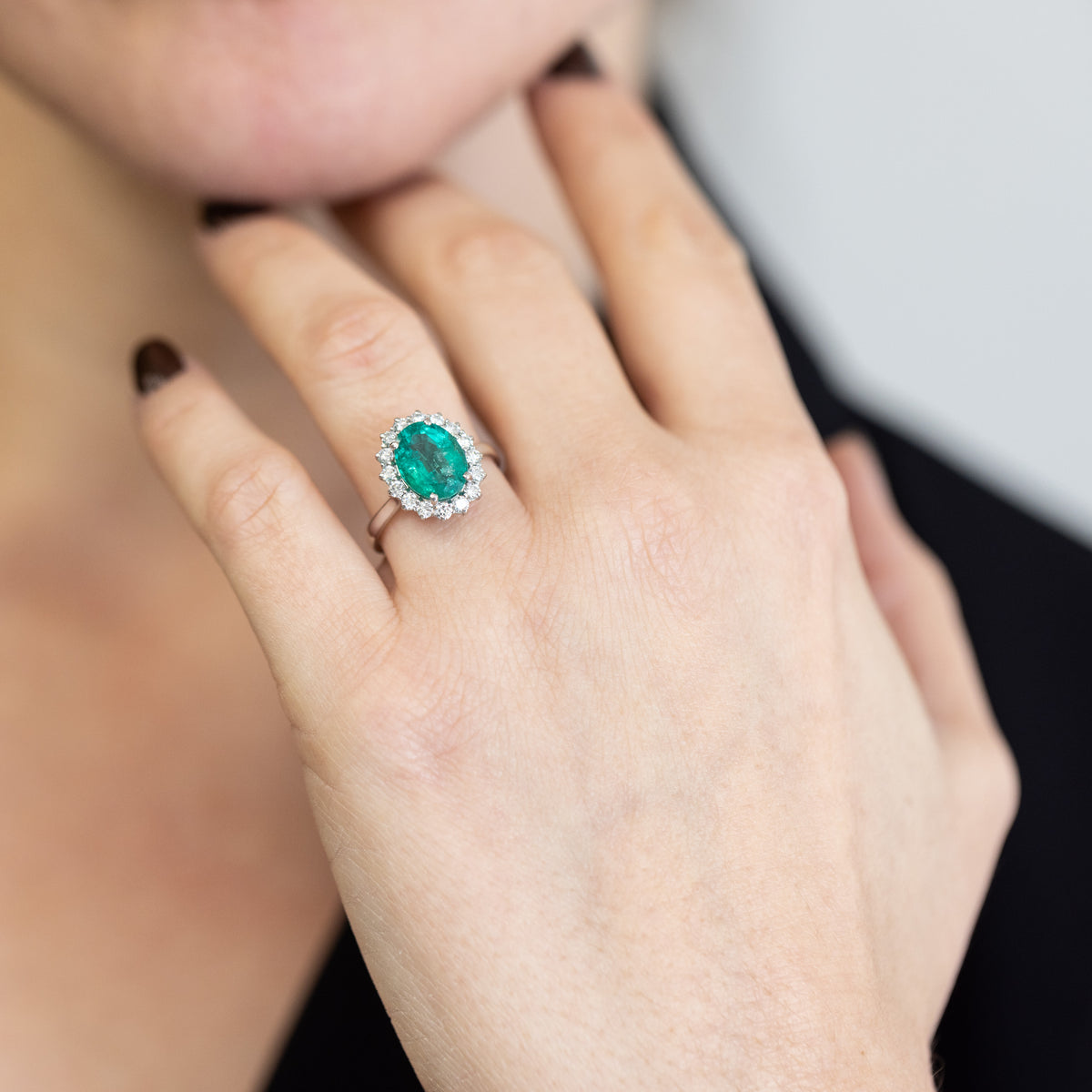 18KT White Gold Ring with 2.11 ct Oval Emerald and Diamond Surround