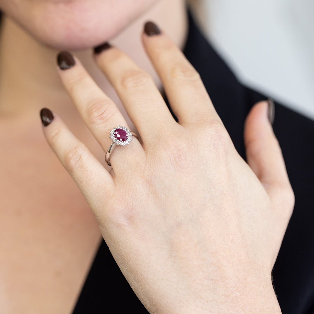 18KT White Gold Ring with Oval Central Ruby and Diamond Surround