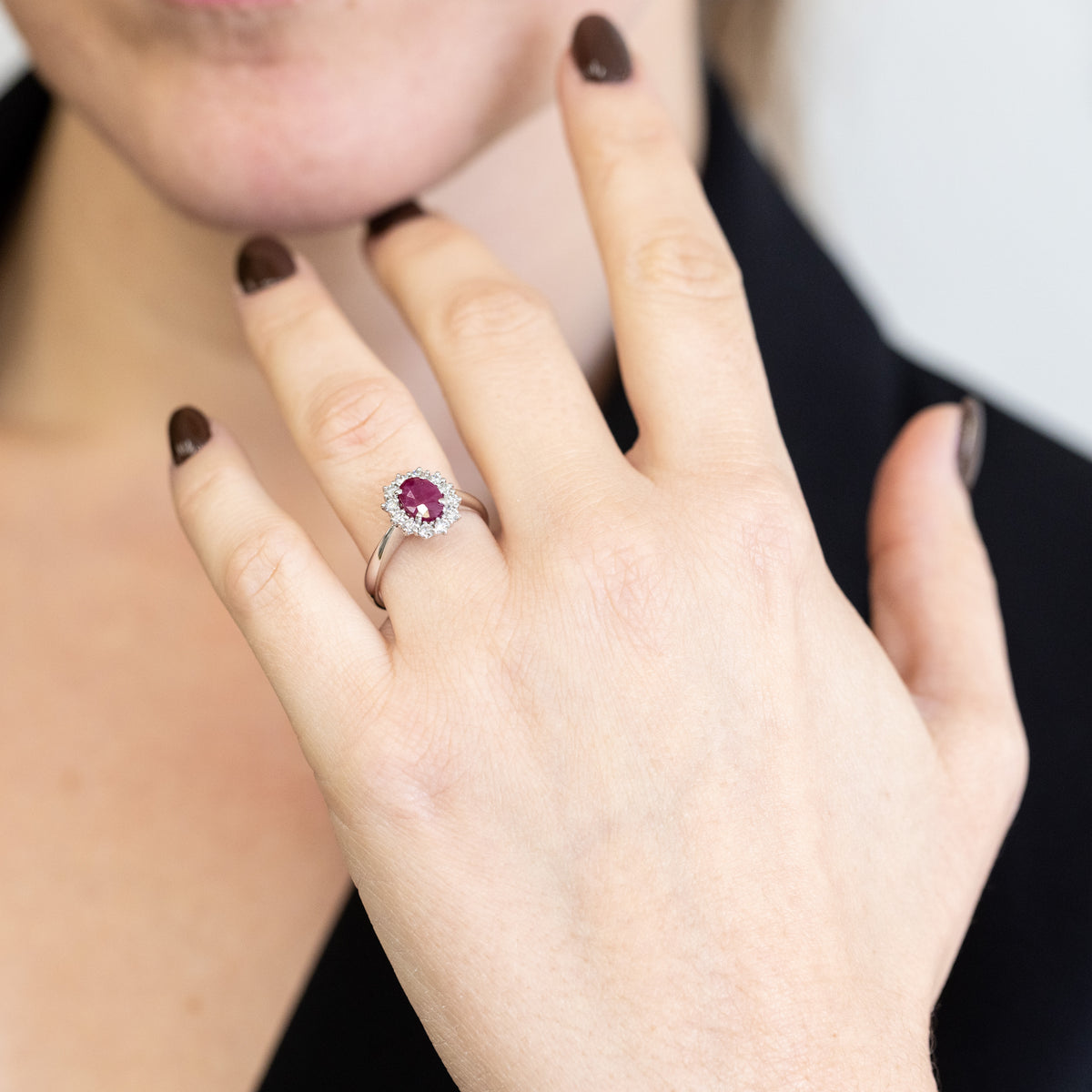 18KT White Gold Ring with Oval Central Ruby and Diamond Surround