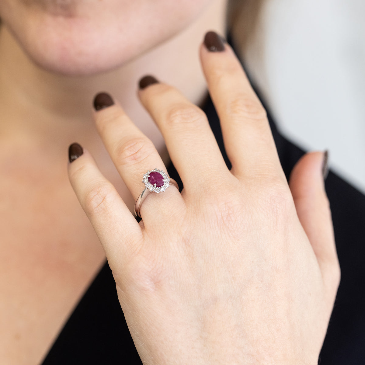 18KT White Gold Ring with Oval Central Ruby and Diamond Surround
