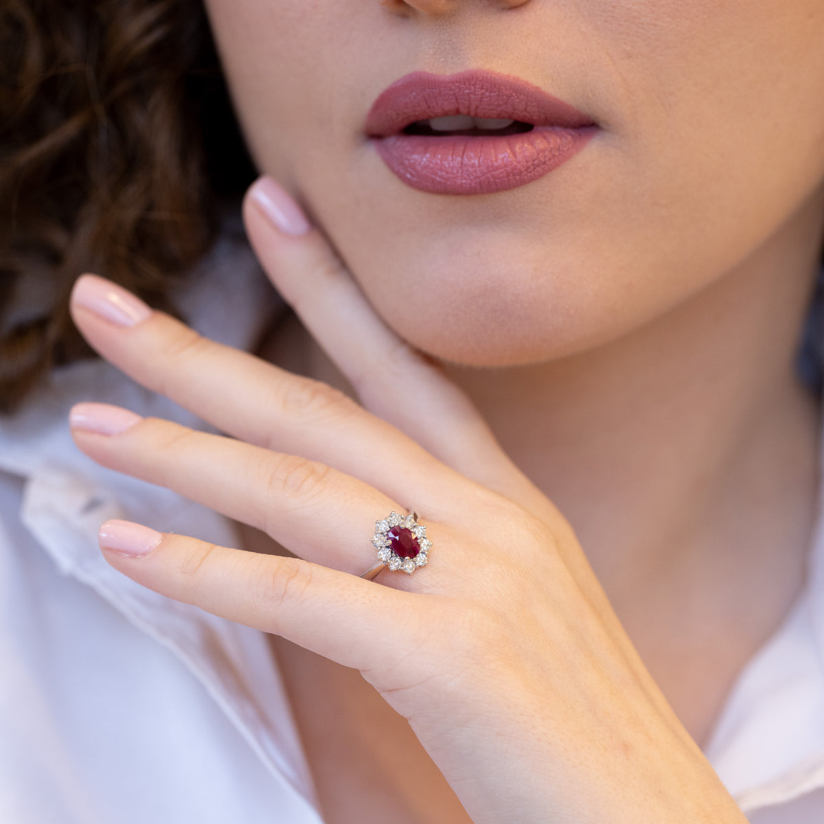 18kt White Gold Ring with Oval Shape Ruby and Diamond Surround