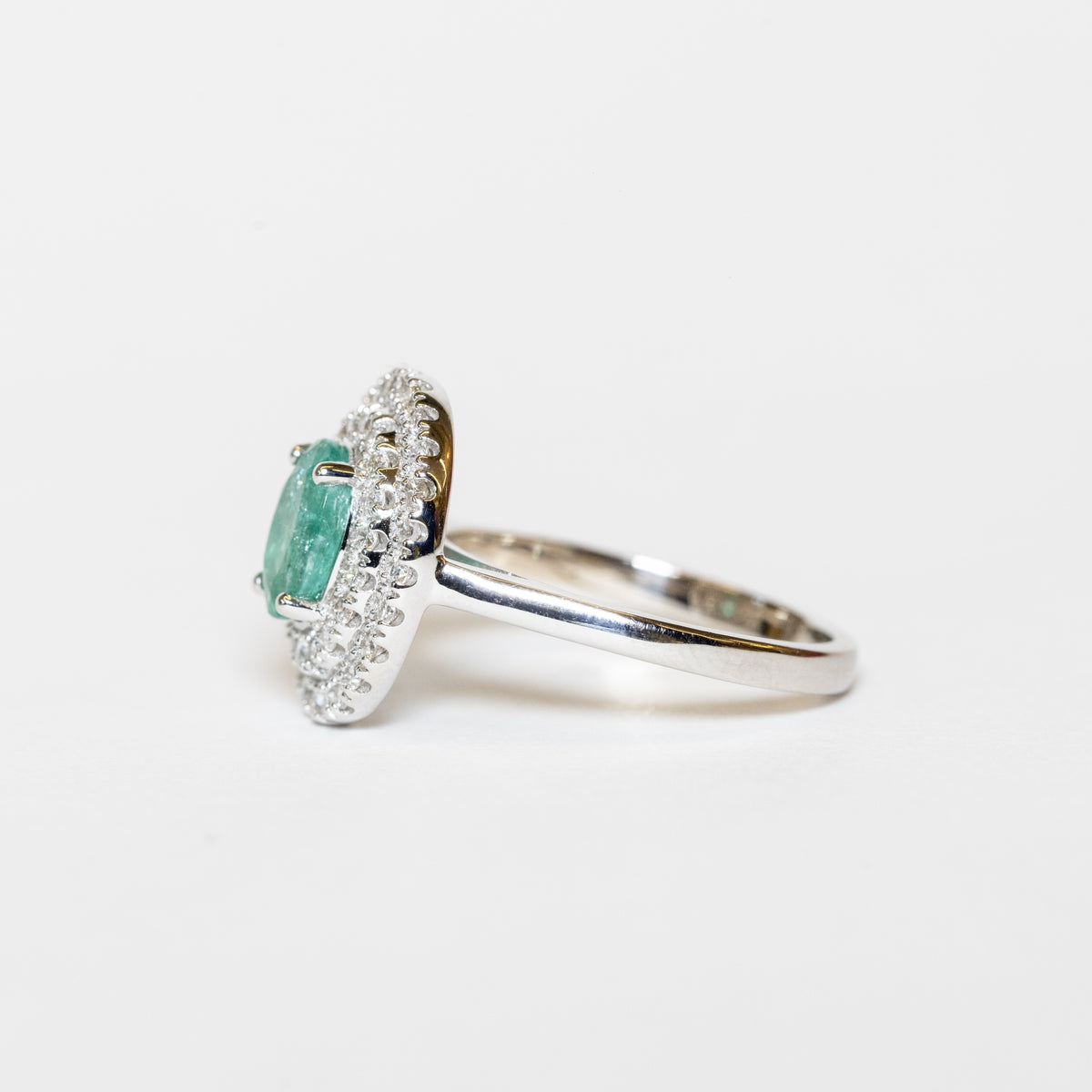 18Kt White Gold Ring With Oval Emerald And Double Row Of Diamonds