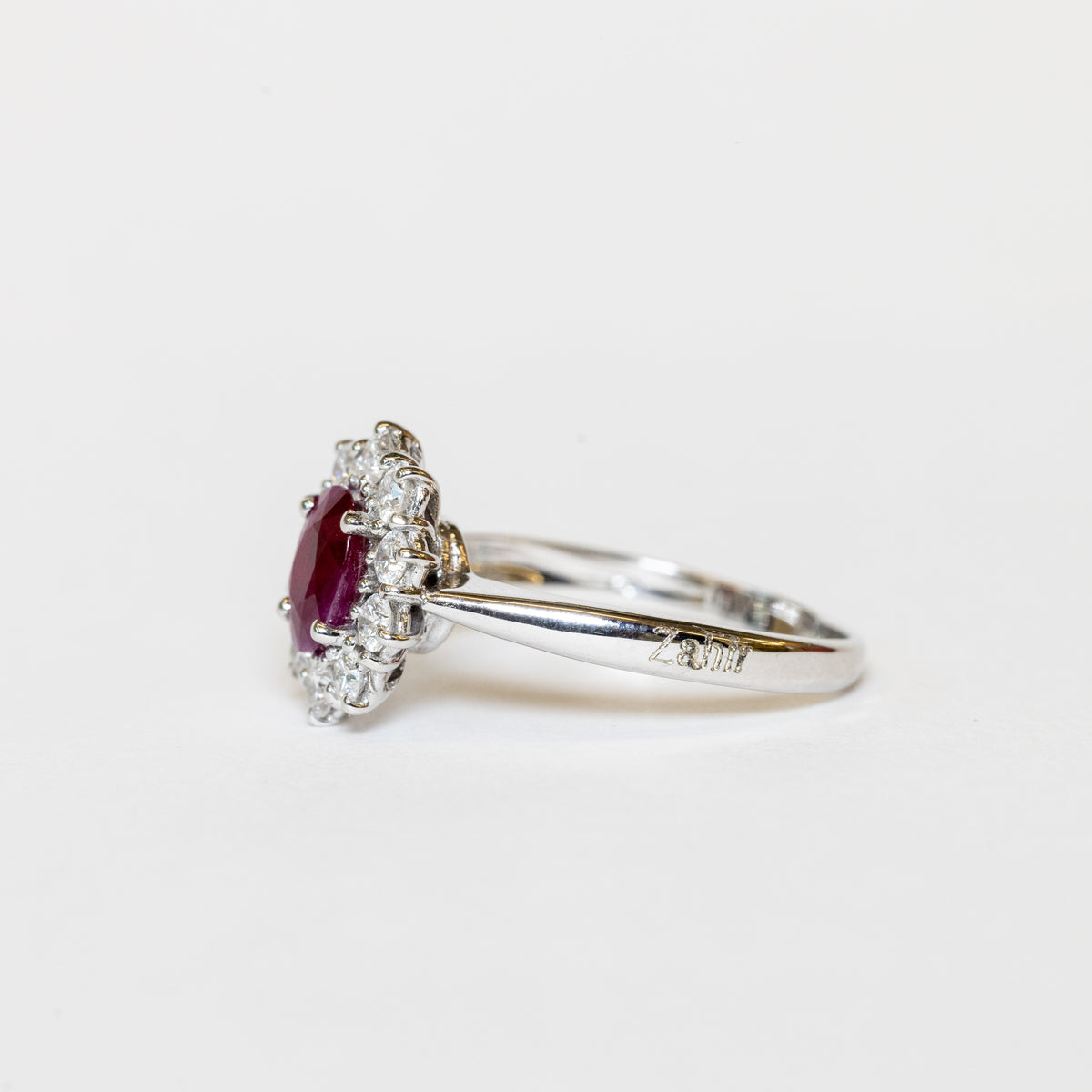 18kt White Gold Ring with Oval Shape Ruby and Diamond Surround
