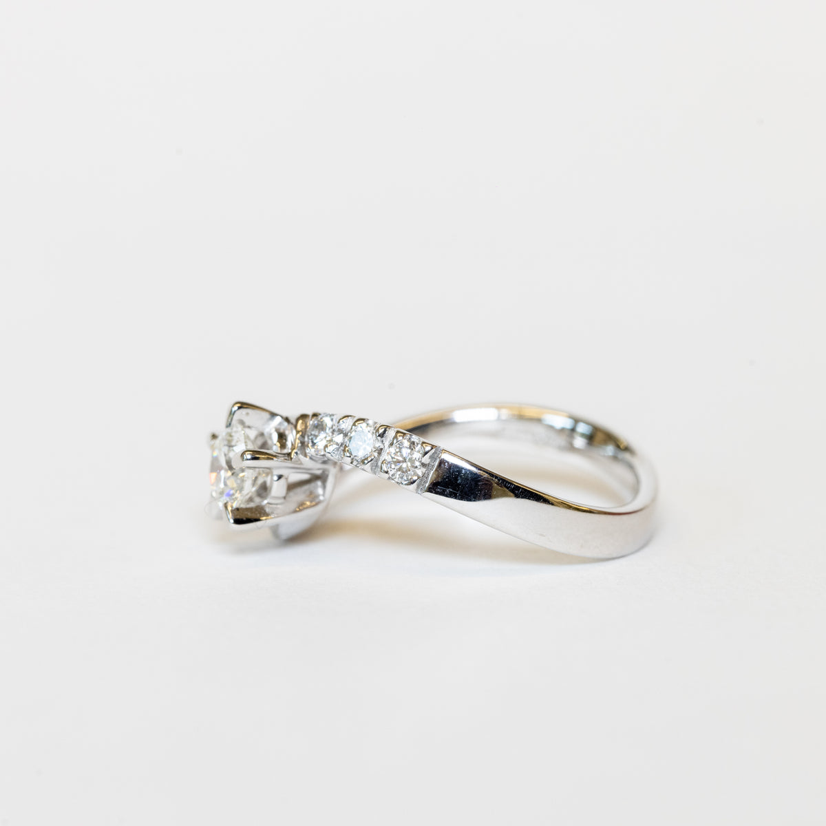 solitaire bypass ring in white gold and diamonds