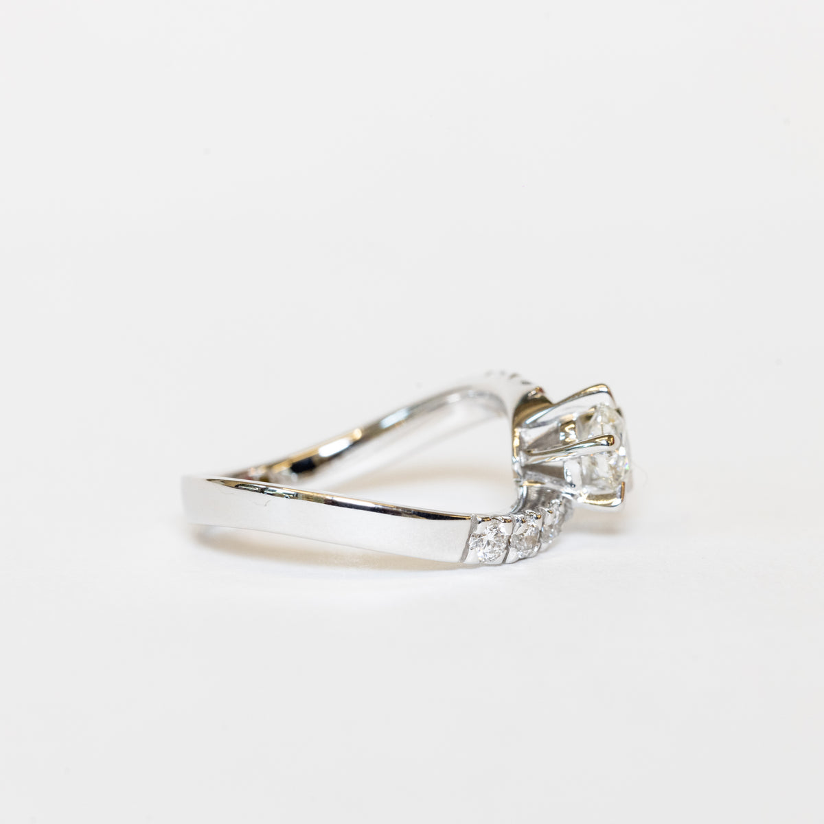 solitaire bypass ring in white gold and diamonds