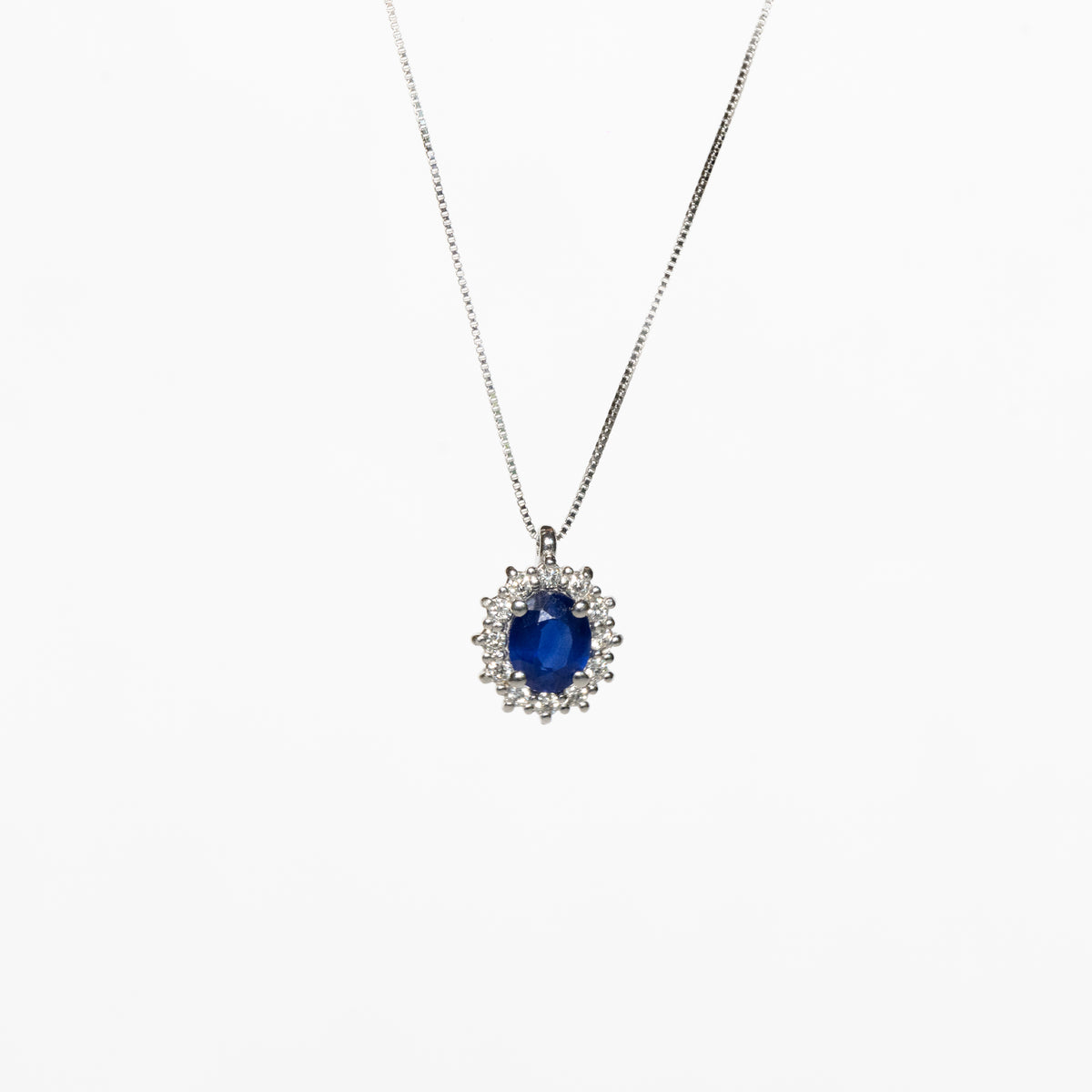 18kt White Gold Necklace With Oval Sapphire Surrounded by Diamonds