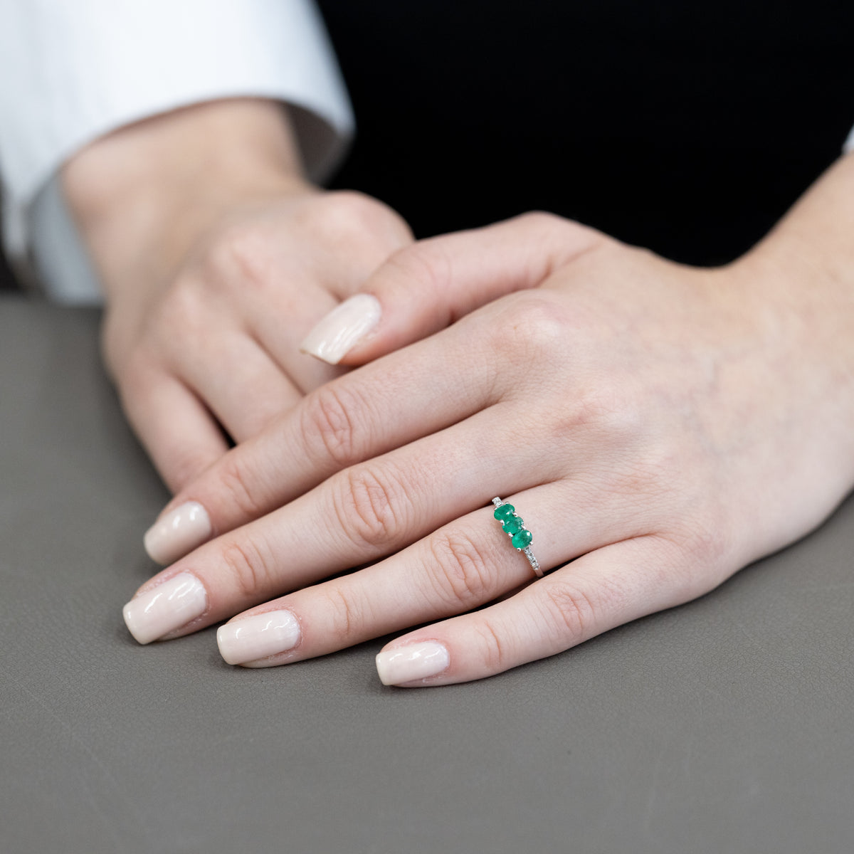 18KT White Gold Trilogy Ring with Emeralds and Diamonds on the Setting