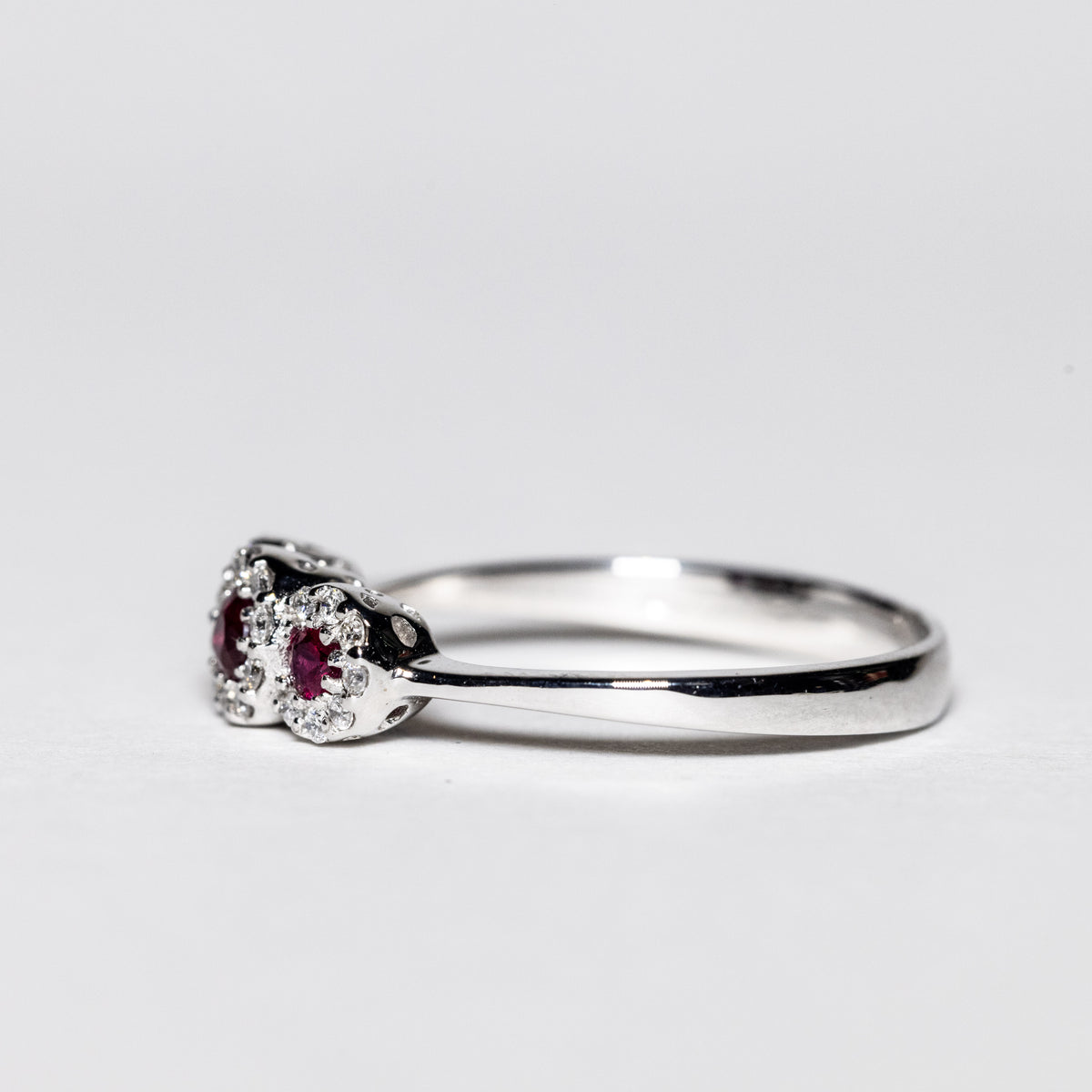 18Kt White Gold Trilogy Ring with Rubies and Diamonds Flower Shape