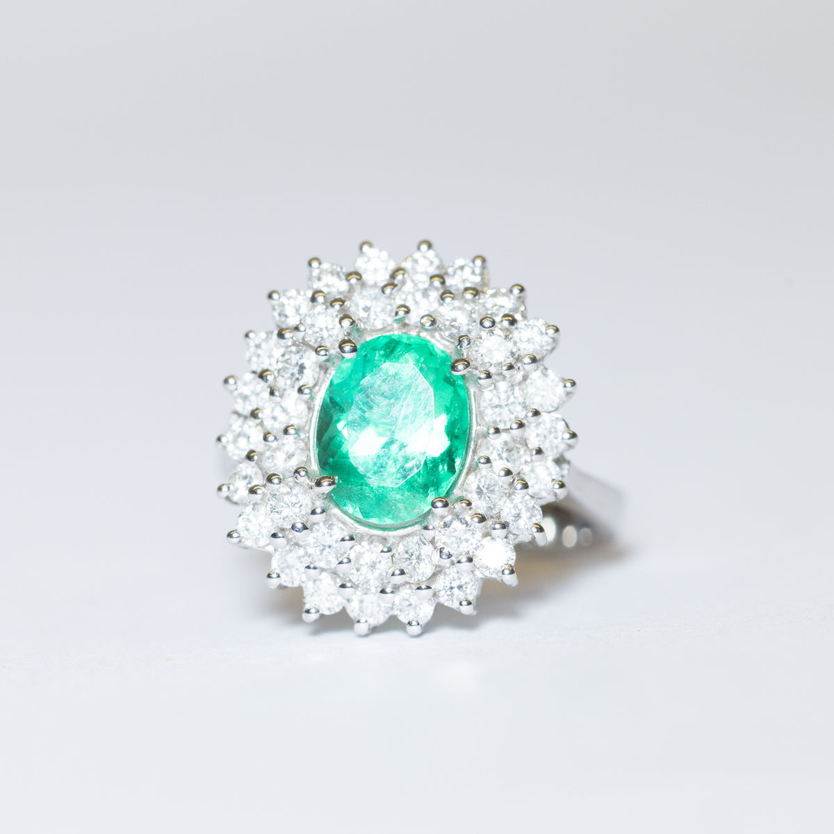 (Two Variants) 18KT White Gold Ring with Central Emerald and Double Diamond Surround