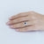 Anello in oro bianco 18 kt con zaffiro centrale forma ovale e contorno in diamanti