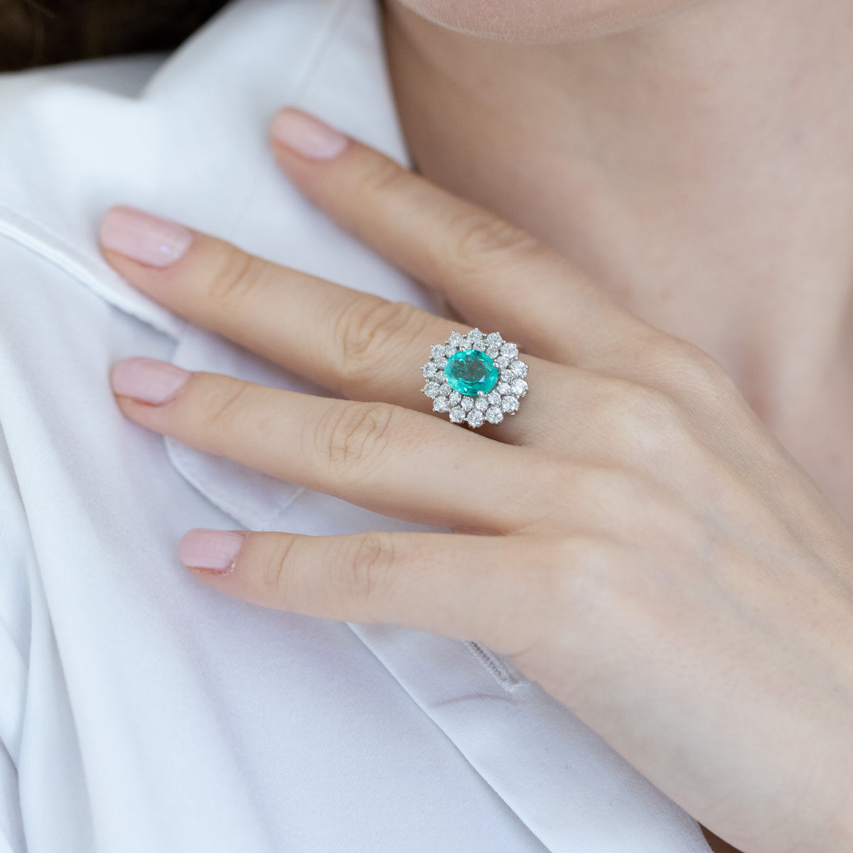 18KT White Gold Ring with Oval-Shaped Central Emerald and Double Diamond Surround