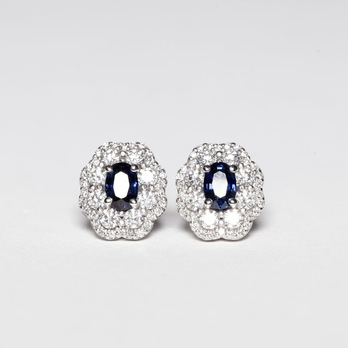 18KT White Gold Earrings With Central Sapphire and Double Row of Flower-Shaped Diamonds 