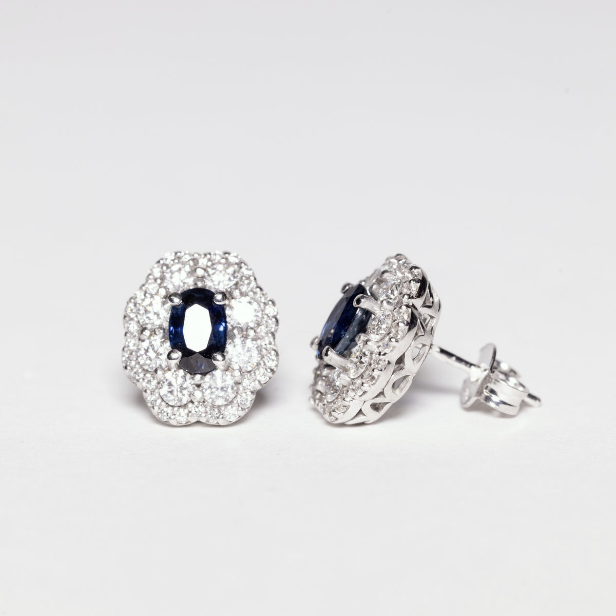 18KT White Gold Earrings With Central Sapphire and Double Row of Flower-Shaped Diamonds 