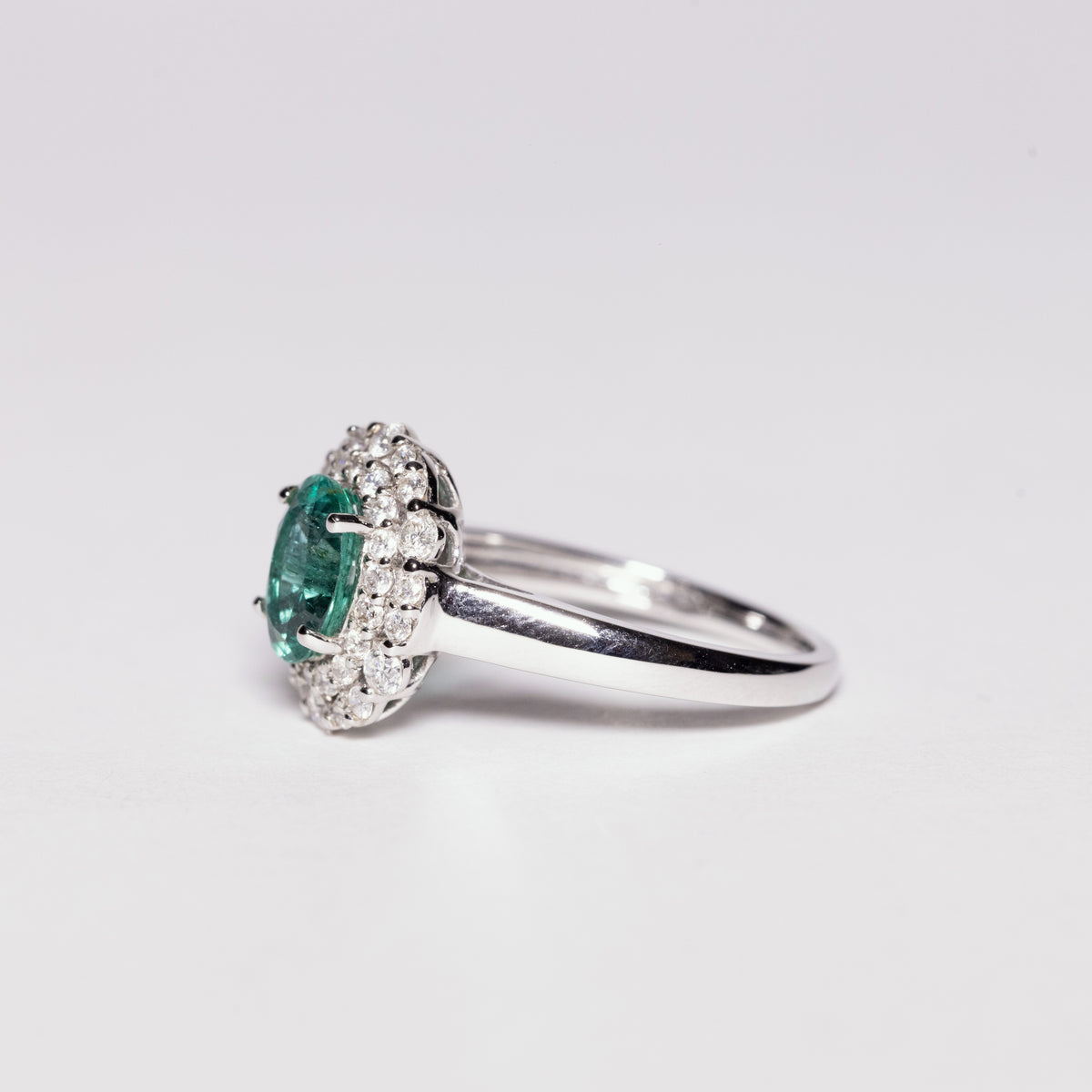 18 KT White Gold Ring With Central Emerald and Double Row of Diamonds