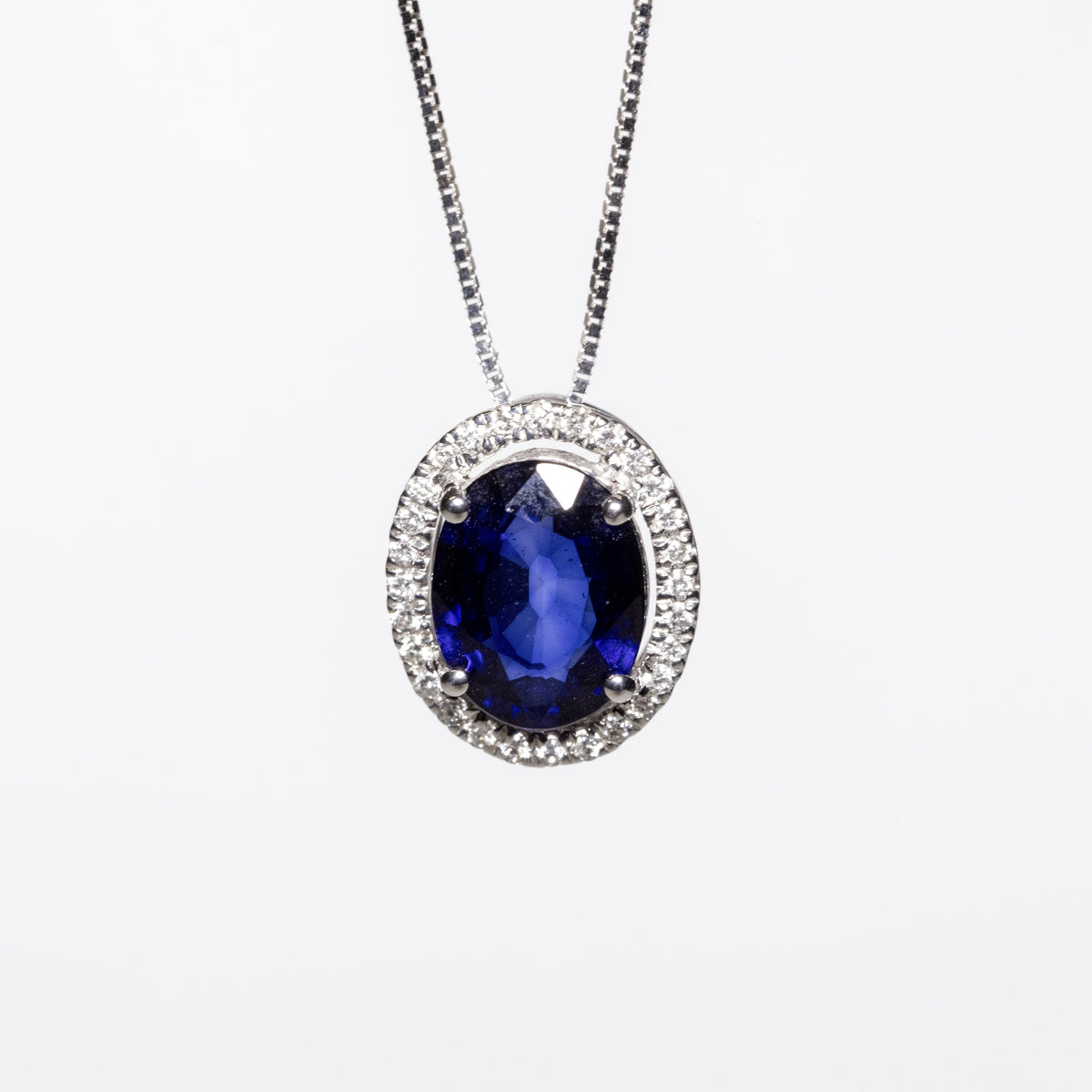 18KT White Gold Necklace With Central Sapphire and Diamond Ring