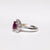 Anello in Oro Bianco KT Con Rubino Centrale e Giro di Diamanti
