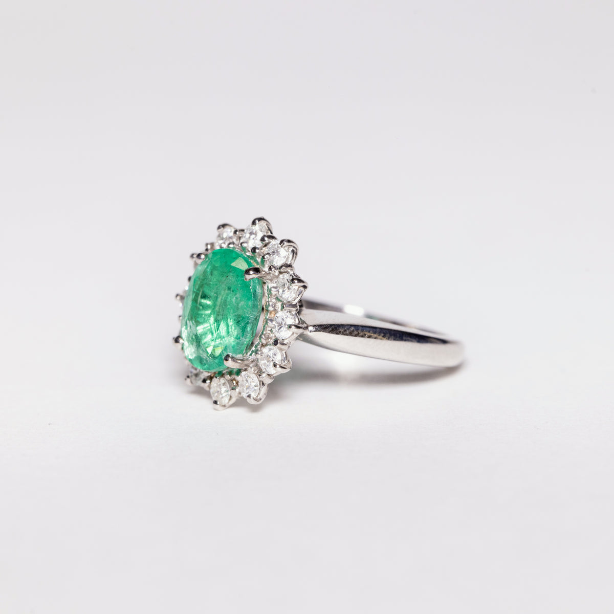 18 KT White Gold Ring With Oval Cut Central Emerald and Diamond Ring