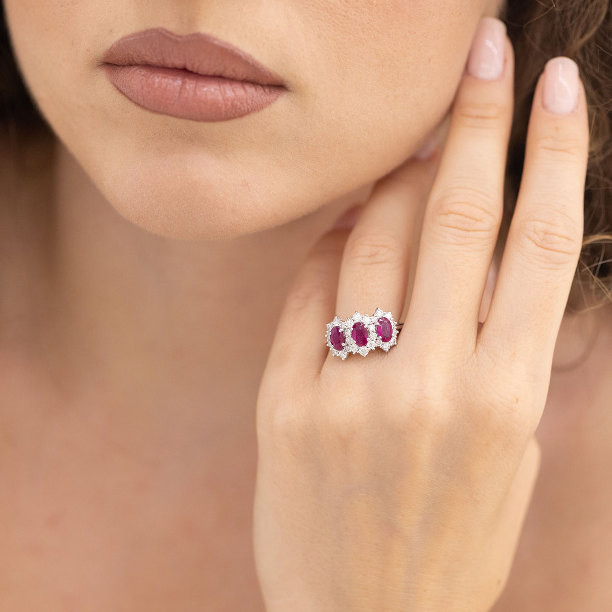 18kt White Gold Trilogy Ring With Rubies Surrounded By Diamonds