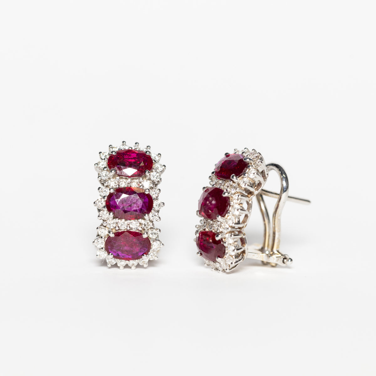 18K White Gold Trilogy Earrings With Rubies Surrounded By Diamonds