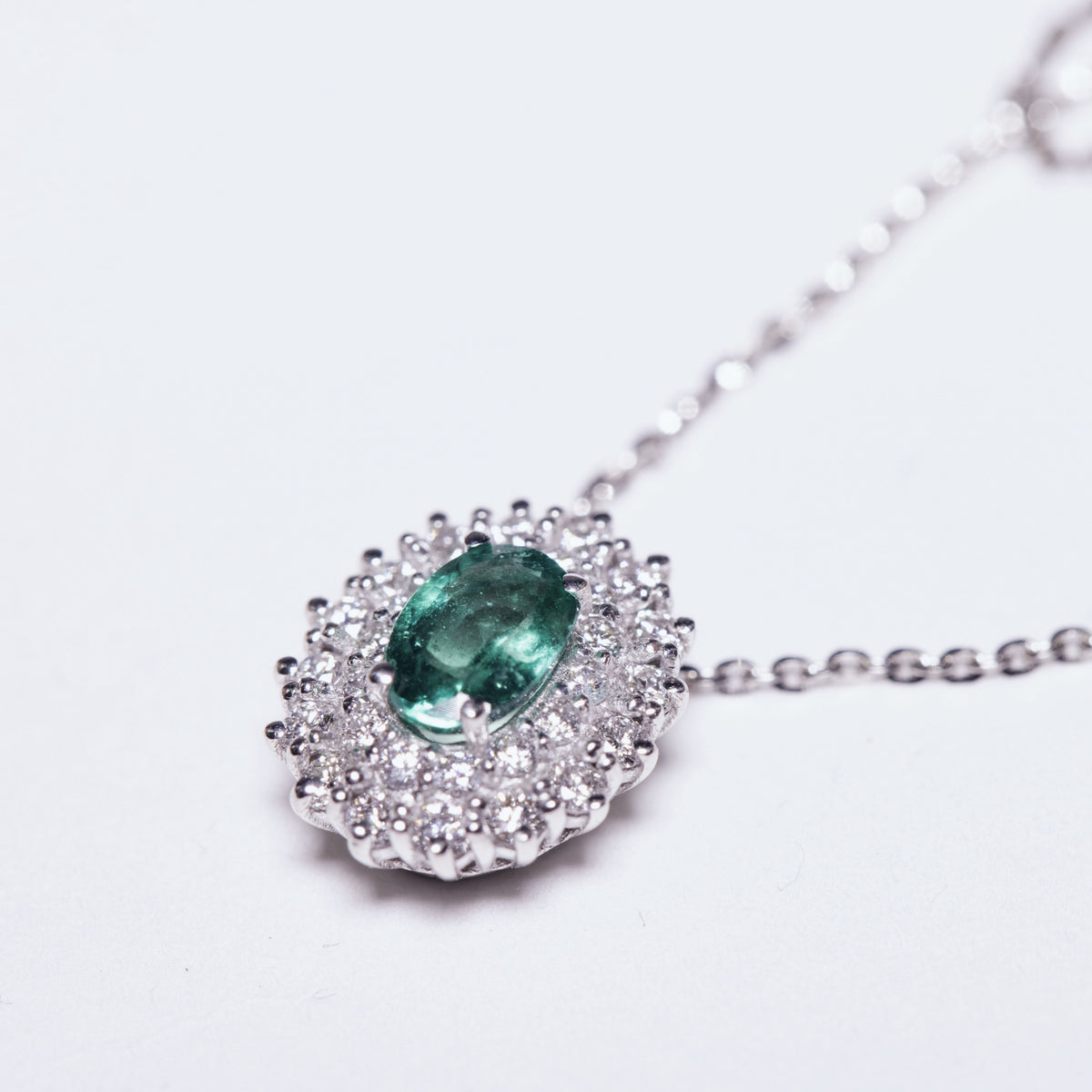 18KT White Gold Necklace with Emerald and Diamond Surround