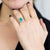 Anello in Oro Bianco 18KT con Smeraldo Ovale da 2,11 ct e contorno in Diamanti
