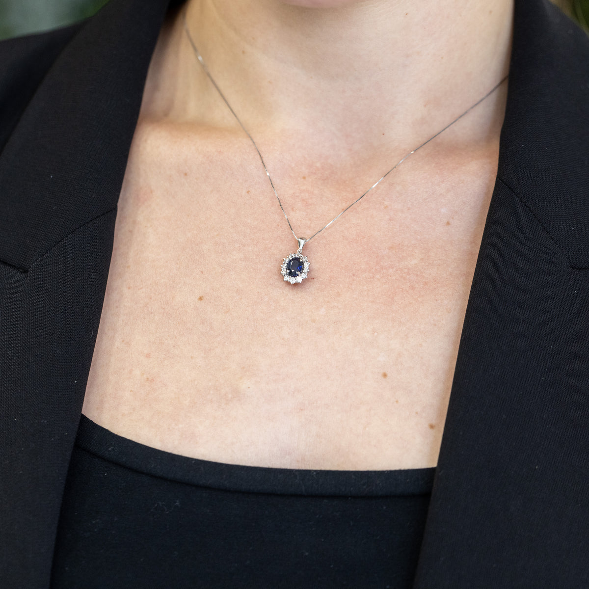18KT White Gold Pendant Necklace with Oval Sapphire and Diamond Surround