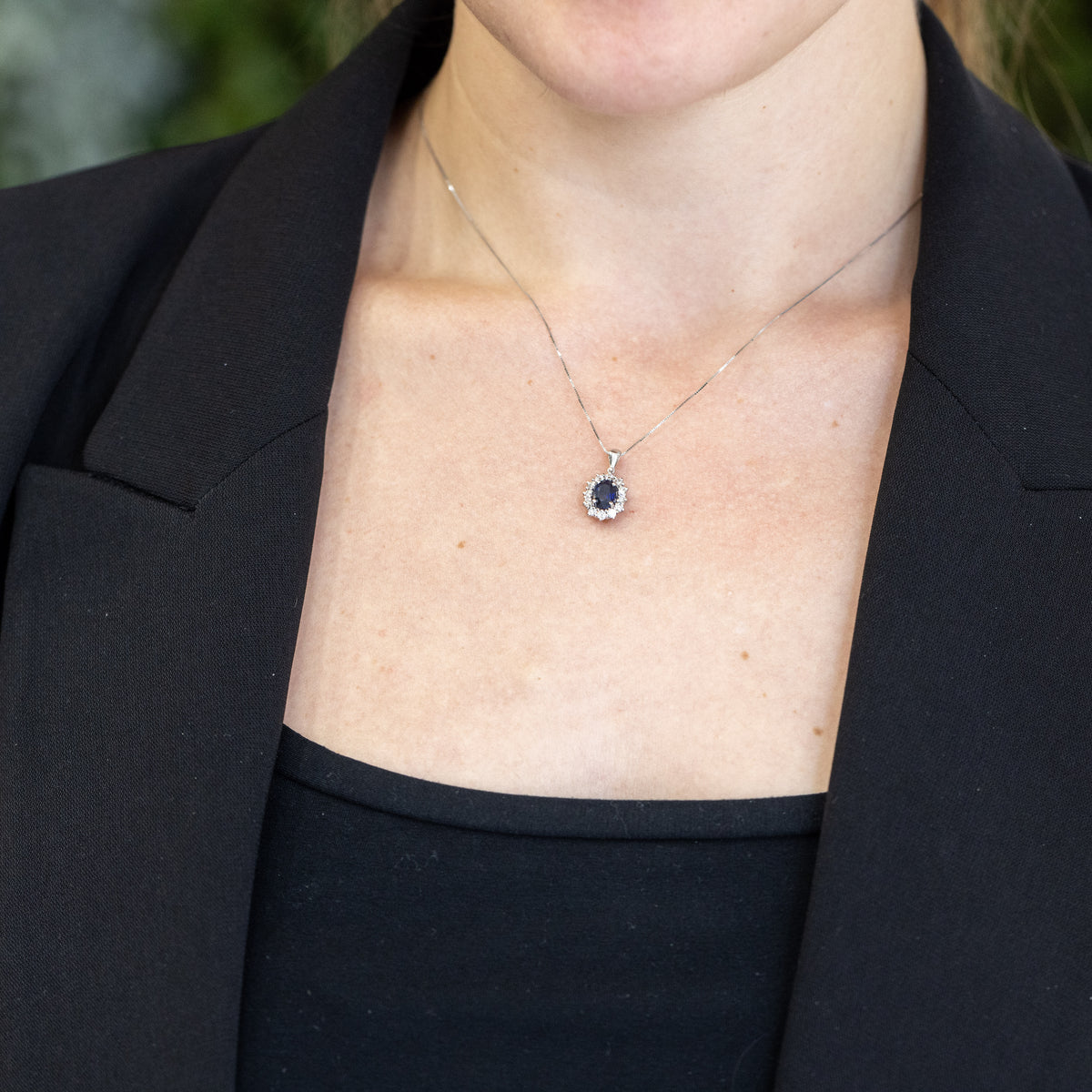 18KT White Gold Pendant Necklace with Oval Sapphire and Diamond Surround