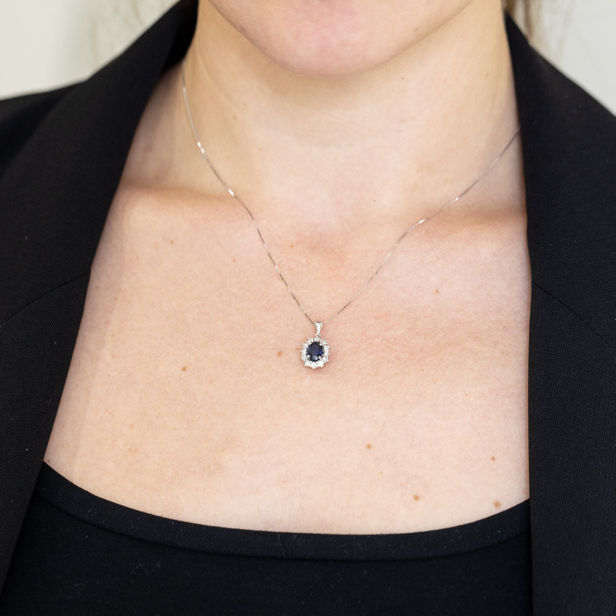 18KT White Gold Pendant Necklace with Oval Sapphire and Diamond Surround