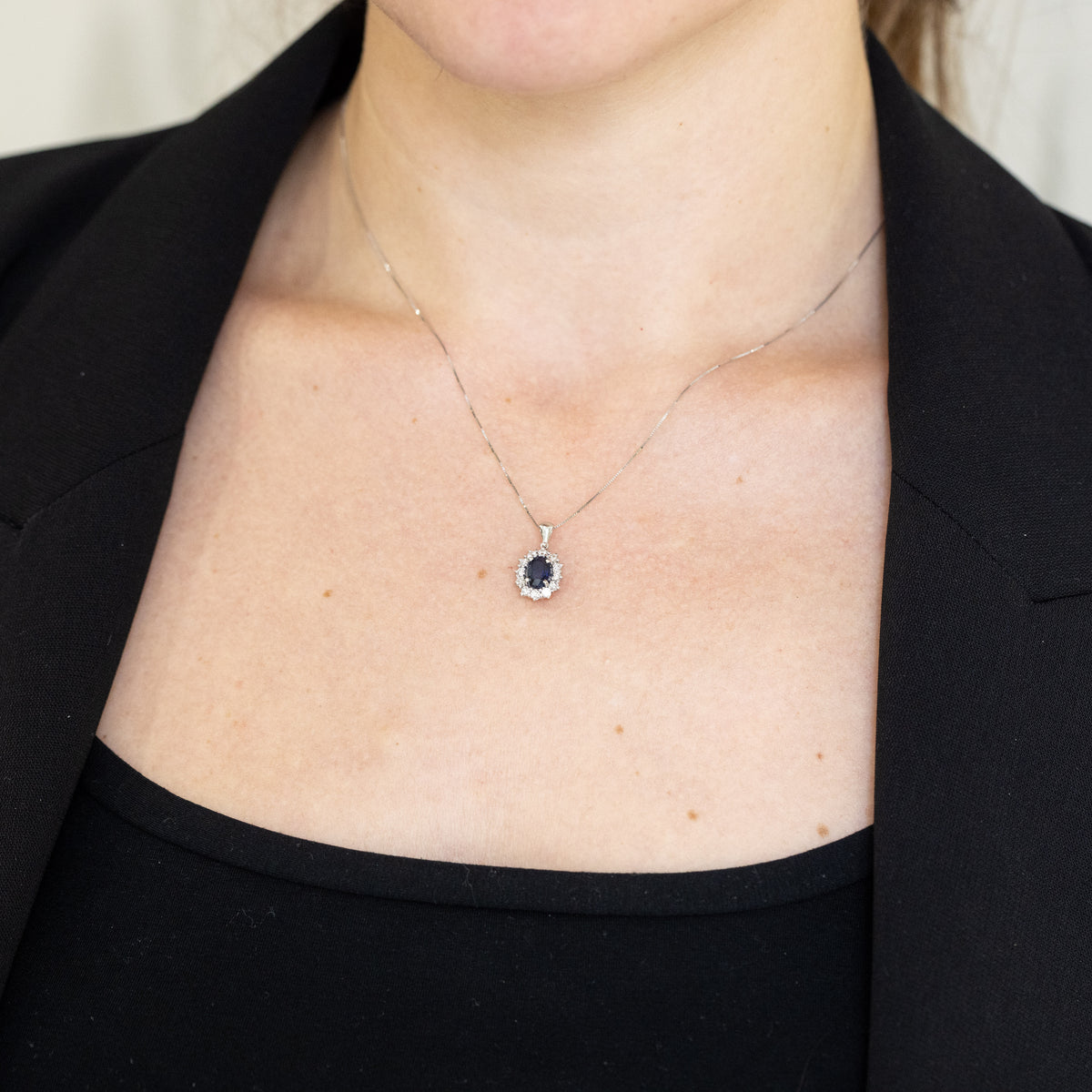 18KT White Gold Pendant Necklace with Oval Sapphire and Diamond Surround