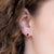 Orecchini In oro bianco 18 kt con rubini e giro di diamanti