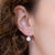 Orecchini in oro bianco 18 kt monachella con diamante centrale e contorno di diamanti