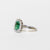 Anello in Oro Bianco 18KT con Smeraldo Forma Emerald e contorno di Diamanti