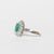 Anello in Oro Bianco 18KT con Smeraldo e doppio giro in Diamanti