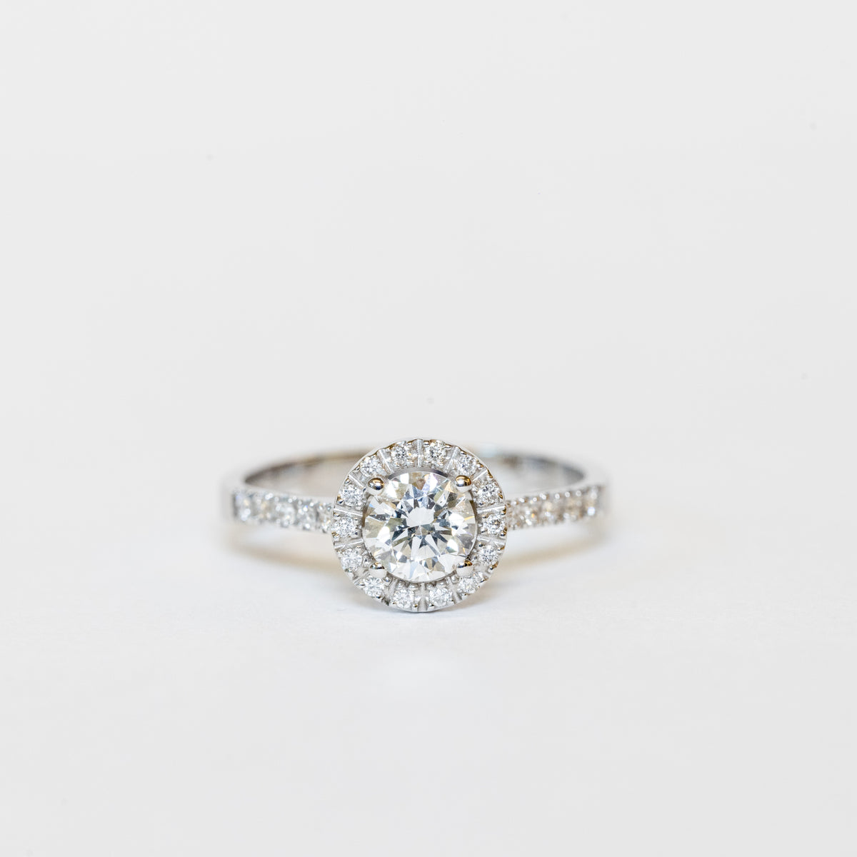 18Kt White Gold Solitaire Ring With Central Diamond And Diamond Row