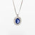 18kt white gold necklace with central sapphire and diamond surround