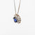18kt white gold necklace with central sapphire and diamond surround