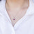 Collana in Oro Bianco 18 kt con Rubino centrale e contorno di Diamanti