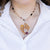 Collana "Cuore Matto" in oro giallo 18 kt con Onice, radice di rubino e diamanti