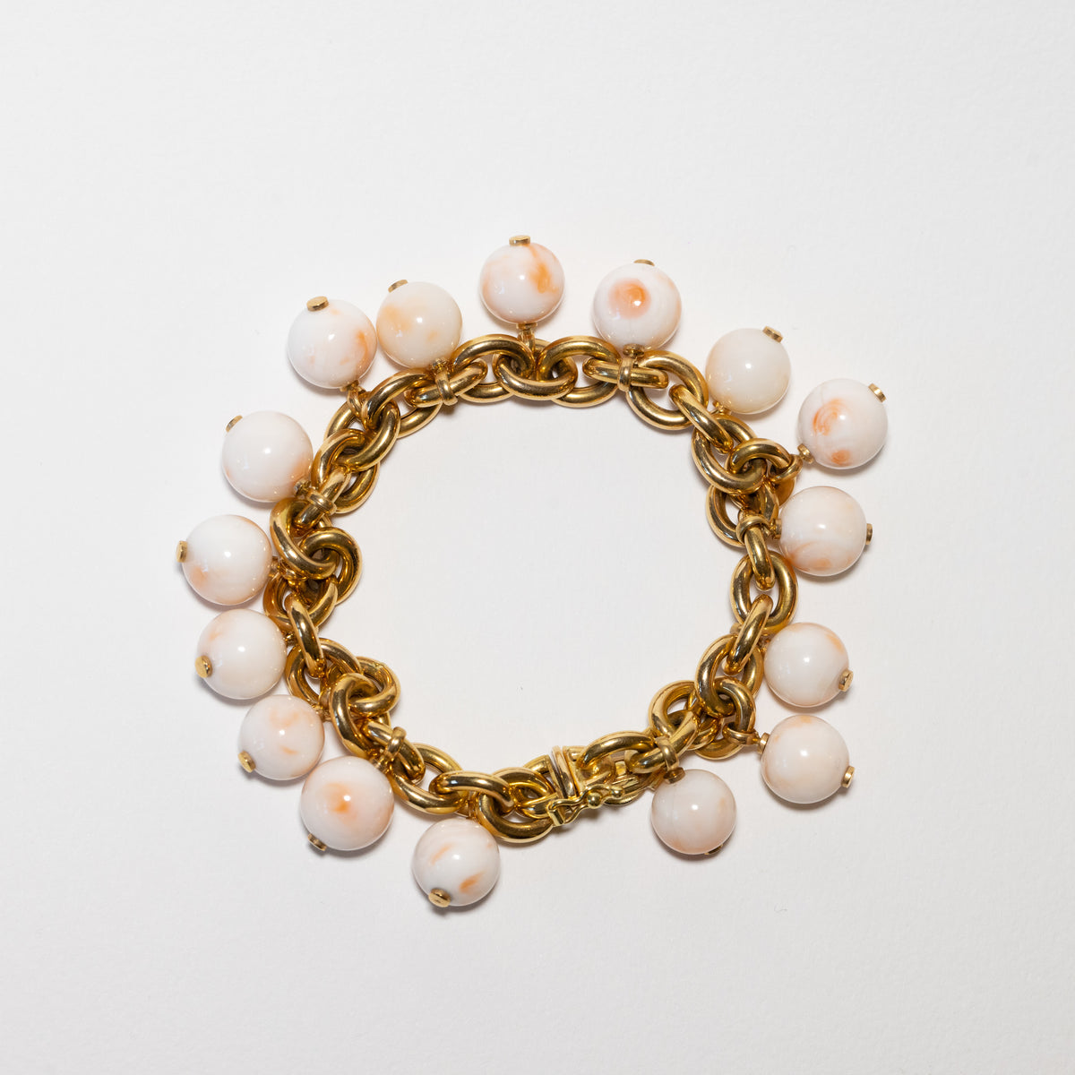 18kt yellow gold and angel skin coral bracelet