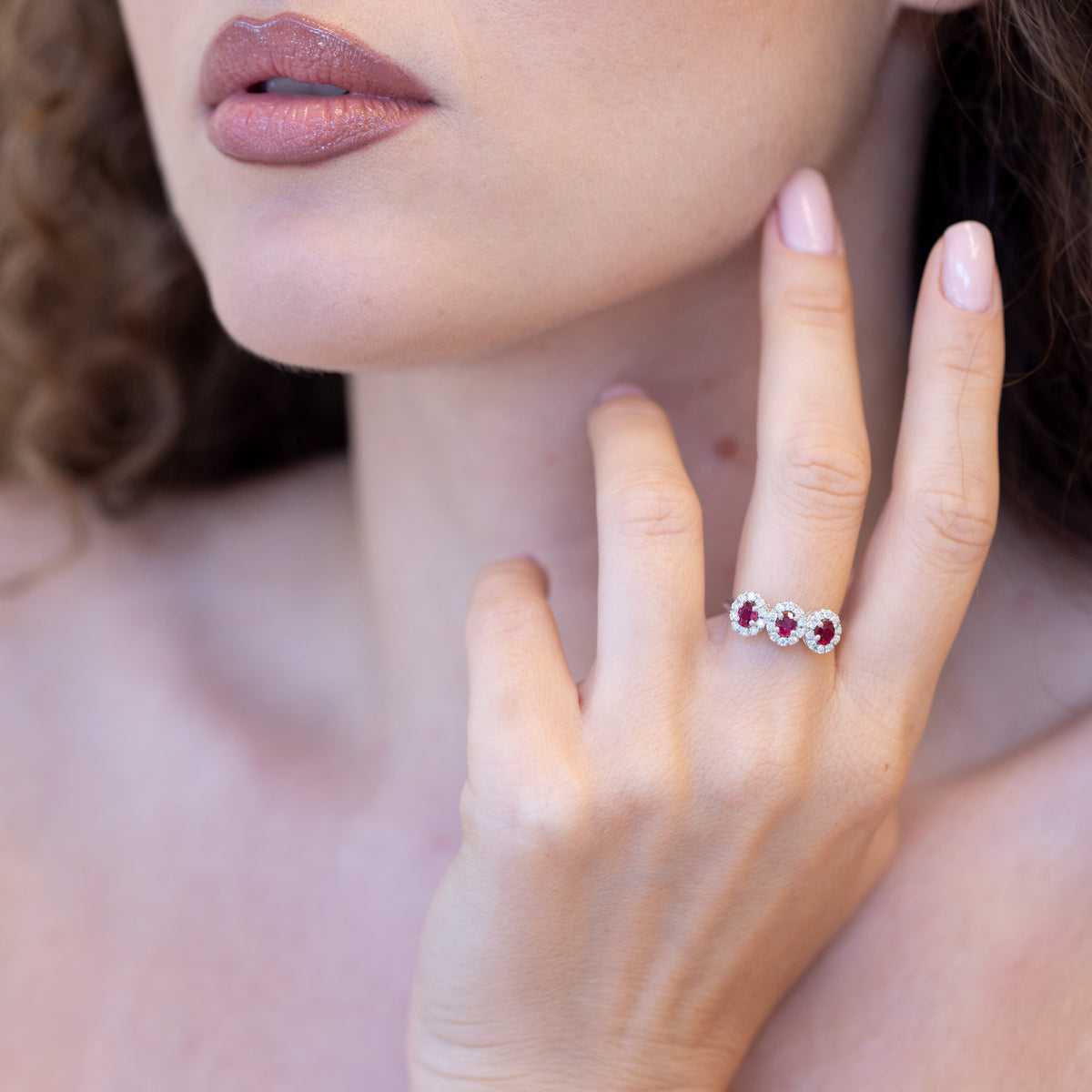 18K White Gold Trilogy Ring With Rubies Surrounded by Diamonds